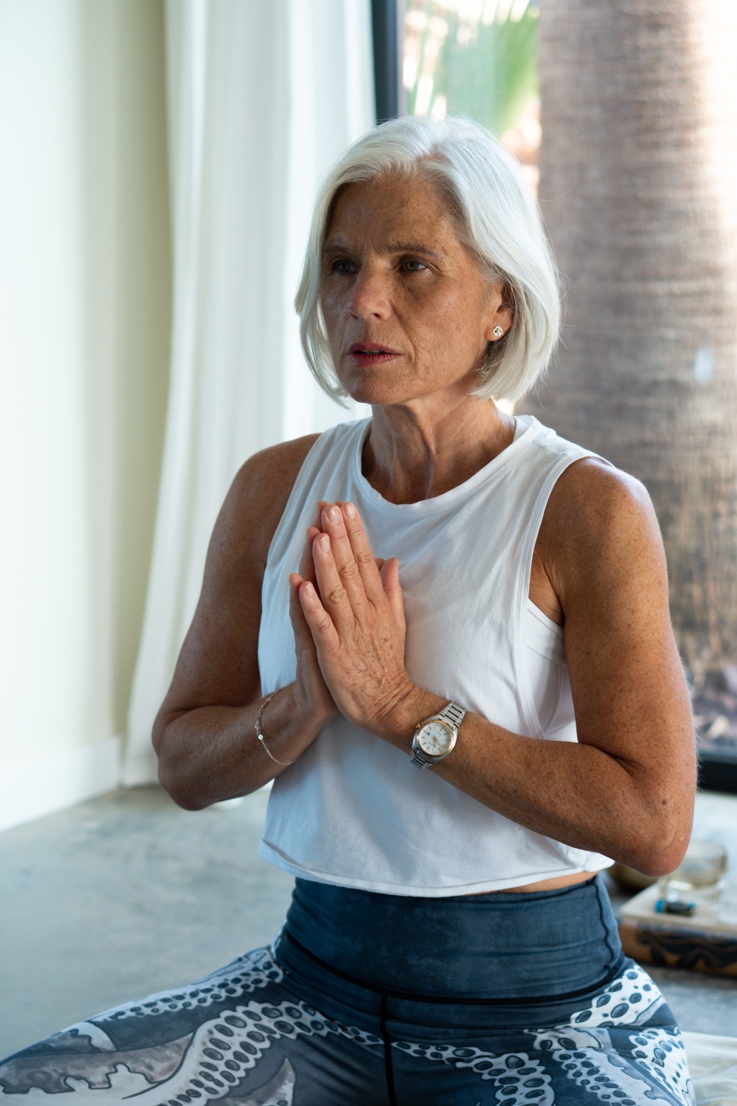 Close-up breathing practice with hands at heart centre